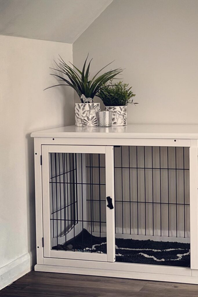 White double bay wire panel dog crate furniture fitted into a room corner