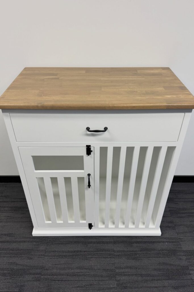White farmhouse dog crate furniture with butcher block top, drawer, and black hardware