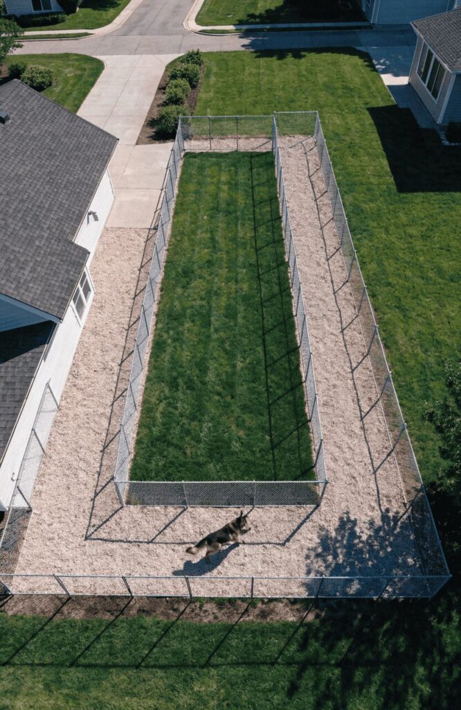 L-shaped corner dog run maximizing backyard corner space