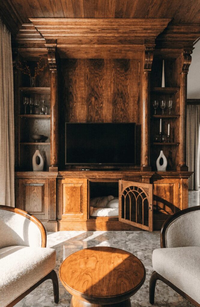 classic built-in dog kennel entertainment center with wooden door and decorative grille