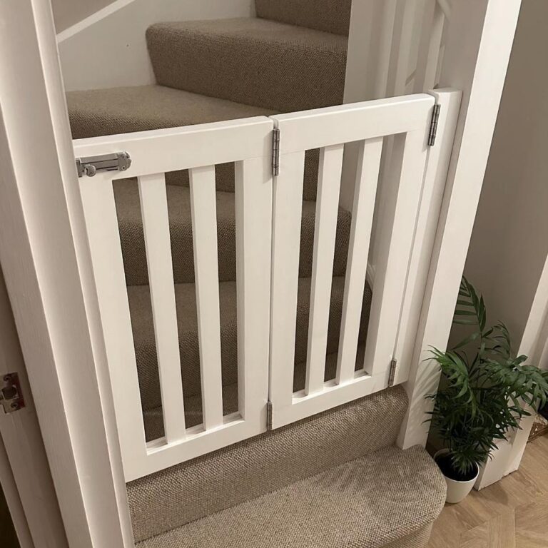 black painted diy dog gates indoor with brass hardware in kitchen doorway