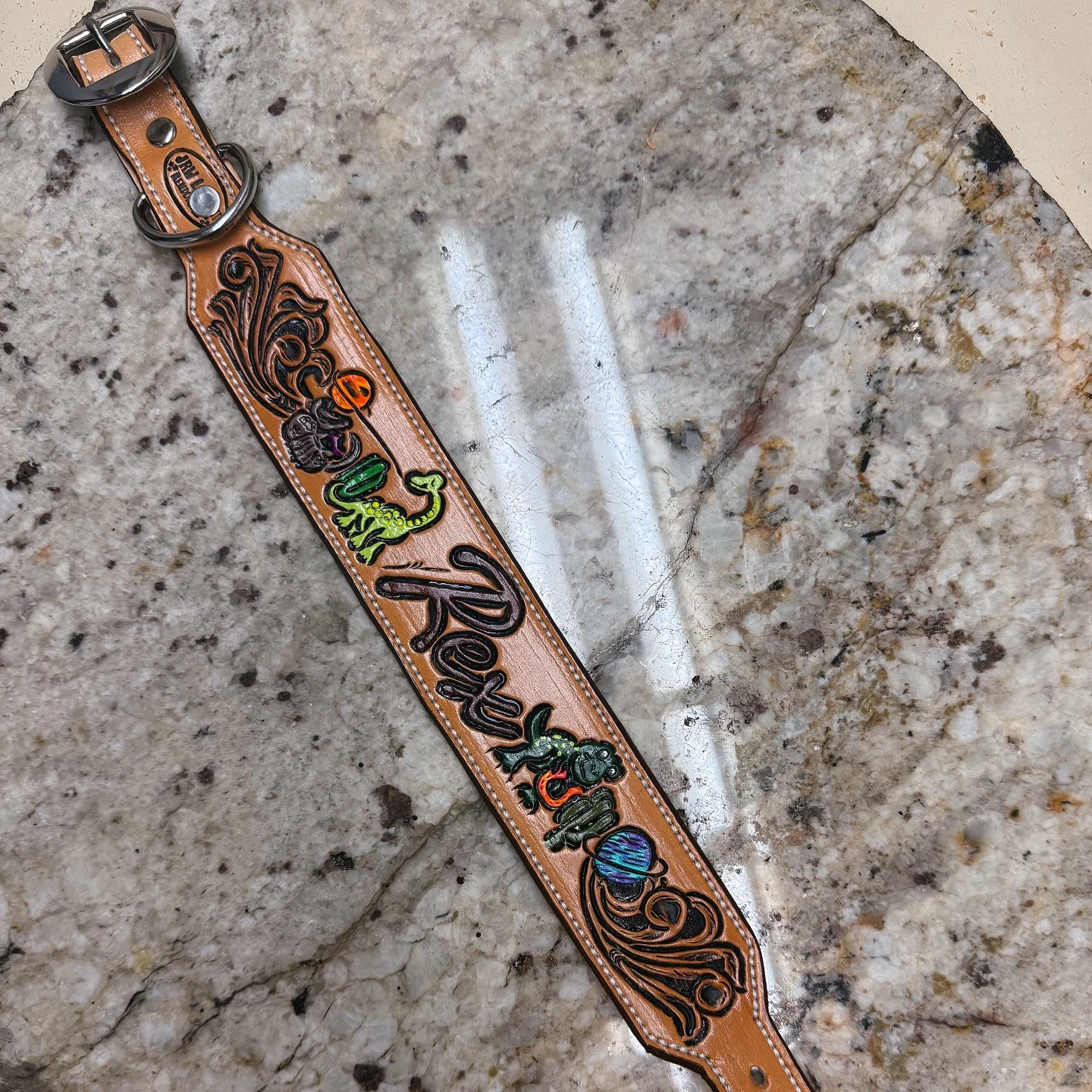 Hand painted custom art leather dog collar with colorful dinosaurs and fantasy motifs on tan leather