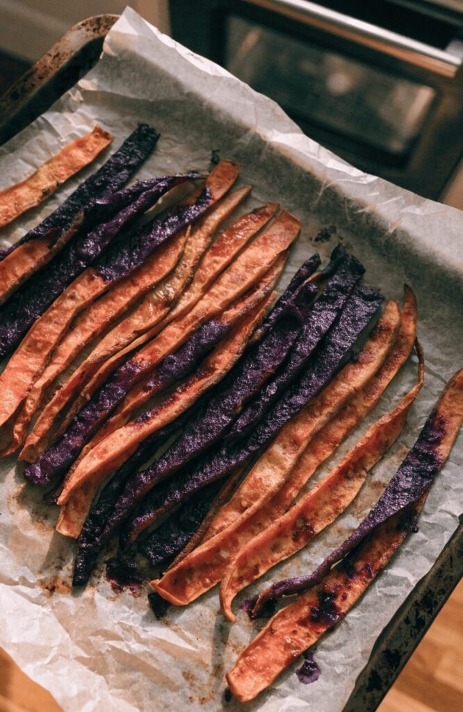 Oven-dried sweet potato slices marinated in blueberry for dog treats