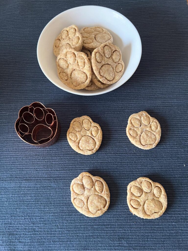 Paw print shaped Italian cheese dog biscuits in bowl