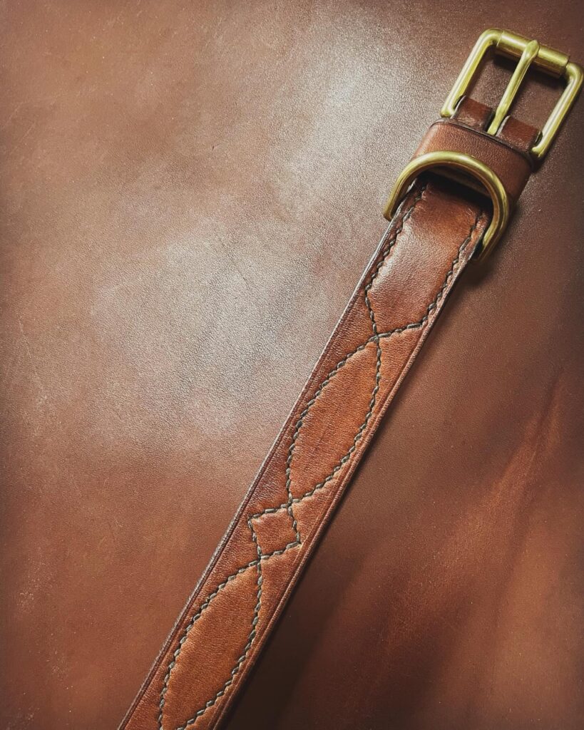 Quilted diamond stitch leather dog collar in rich tan with brass buckle showing detailed stitching pattern