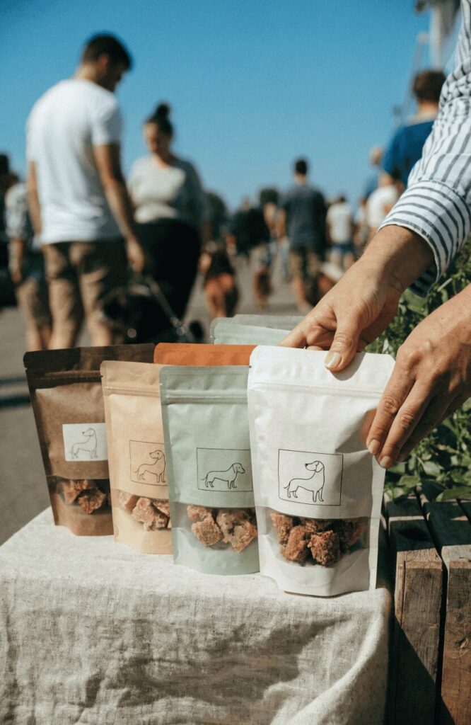 stand up resealable dog treat packaging pouch displayed at outdoor market stall