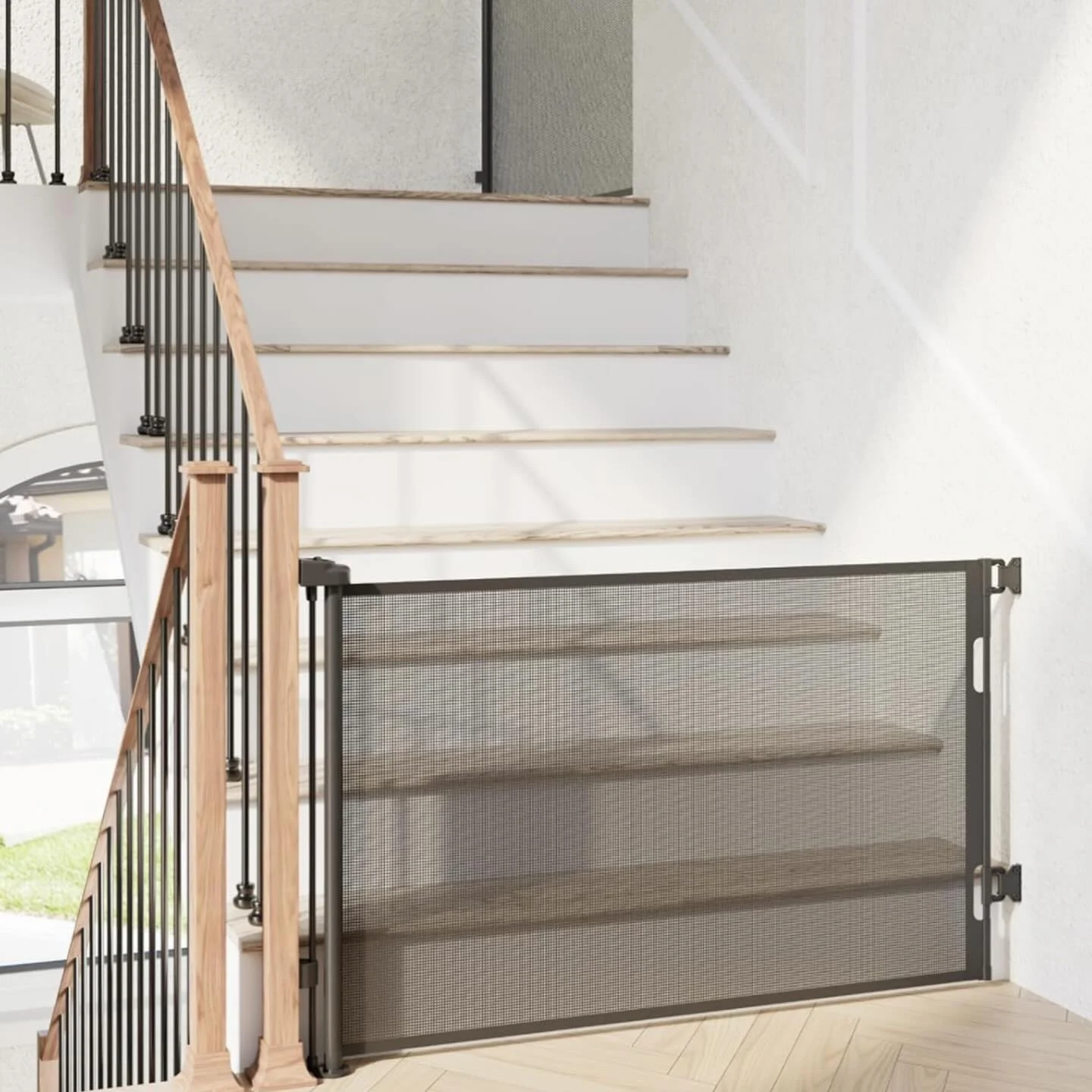 retractable mesh dog gate installed at top of staircase