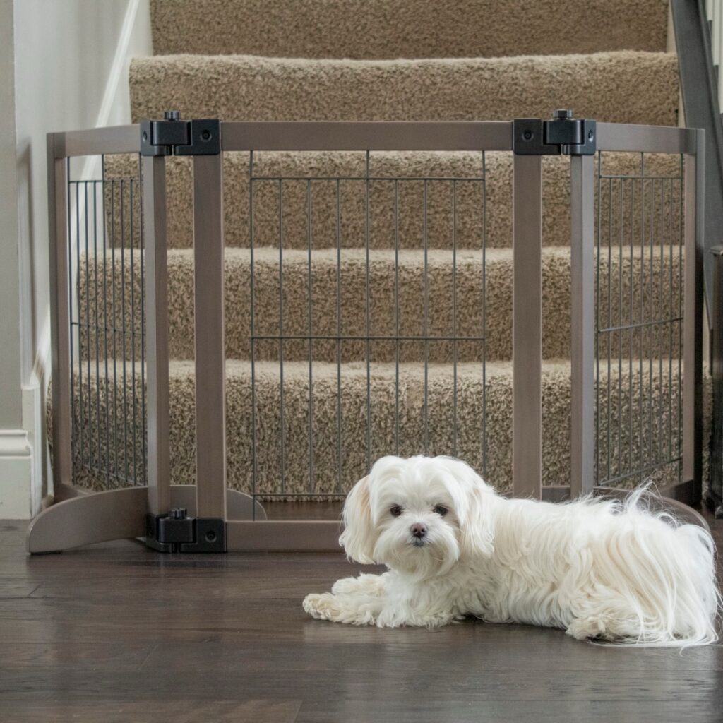 tri panel wire mesh freestanding dog gate at bottom of stairs