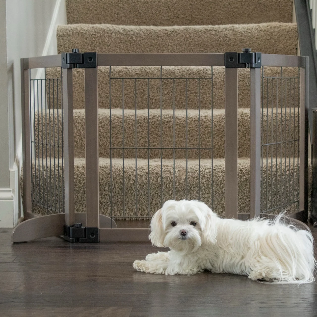 tri panel wire mesh freestanding dog gate at bottom of stairs