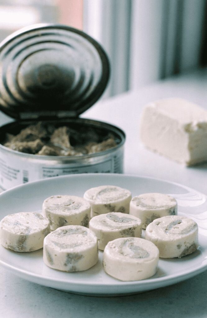 no-bake tuna cream cheese homemade dog treat bites on white plate