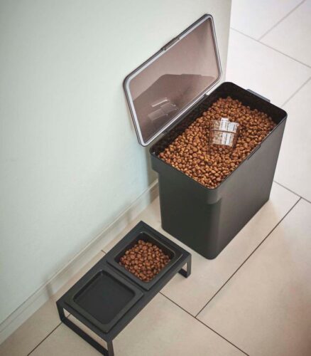 Black canister and elevated bowl stand for dog food