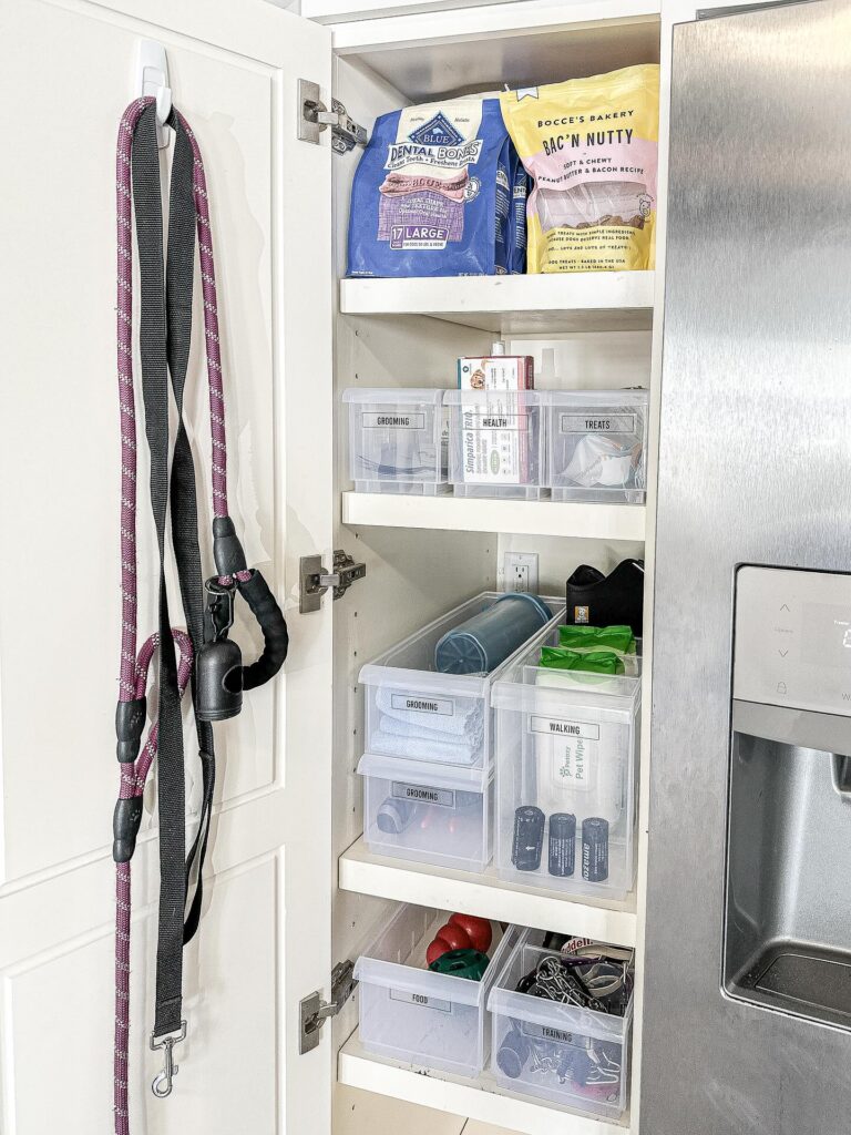Organized pet supply closet with labeled bins for dog