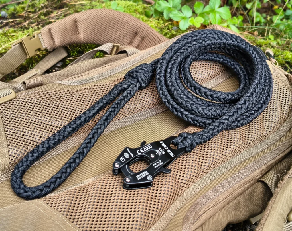 Tactical style paracord leash coiled on backpack