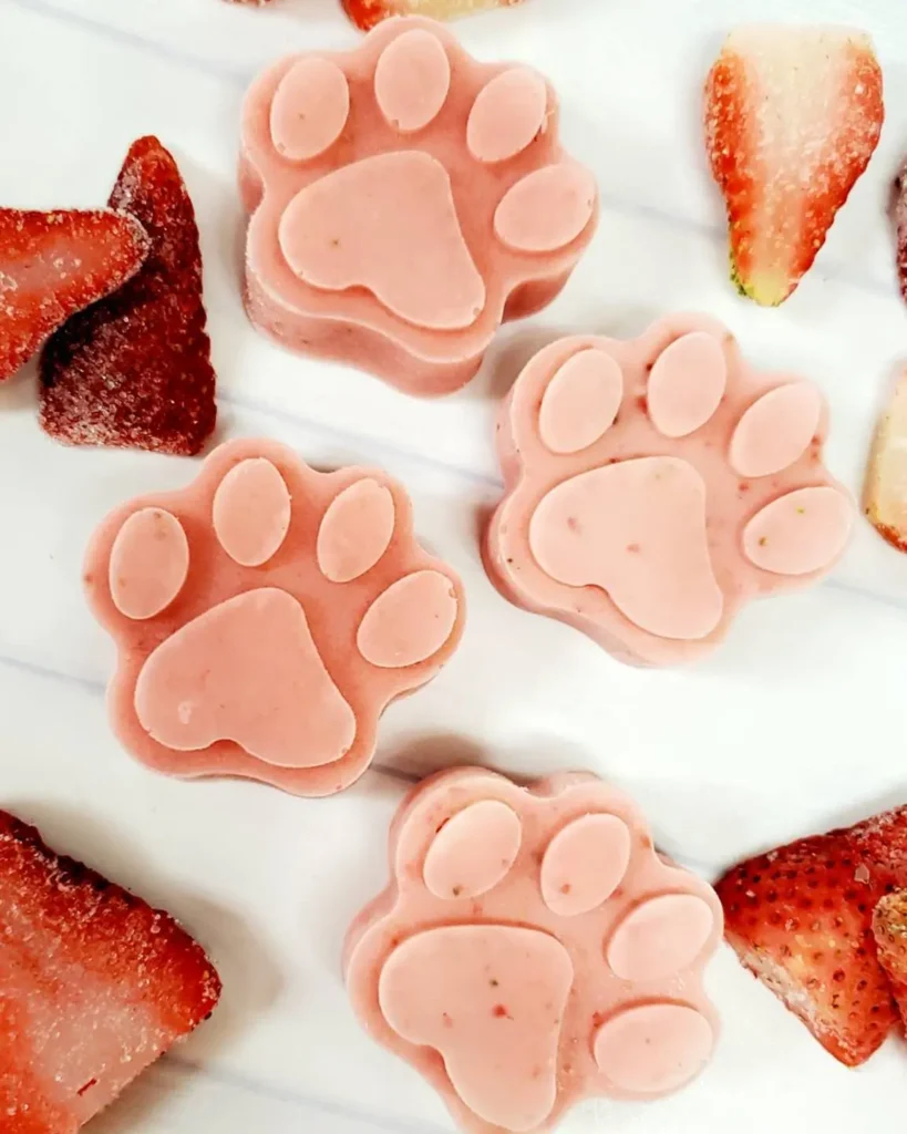 Close up of strawberry frozen yogurt paw print dog treats