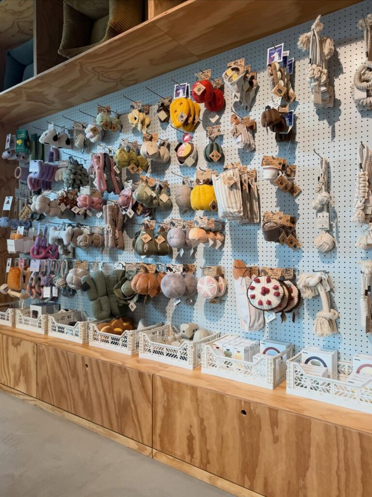 Whimsical novelty toy wall display with signage