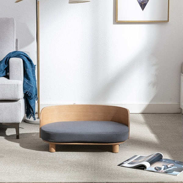 Bent plywood curved wood dog bed in modern living room