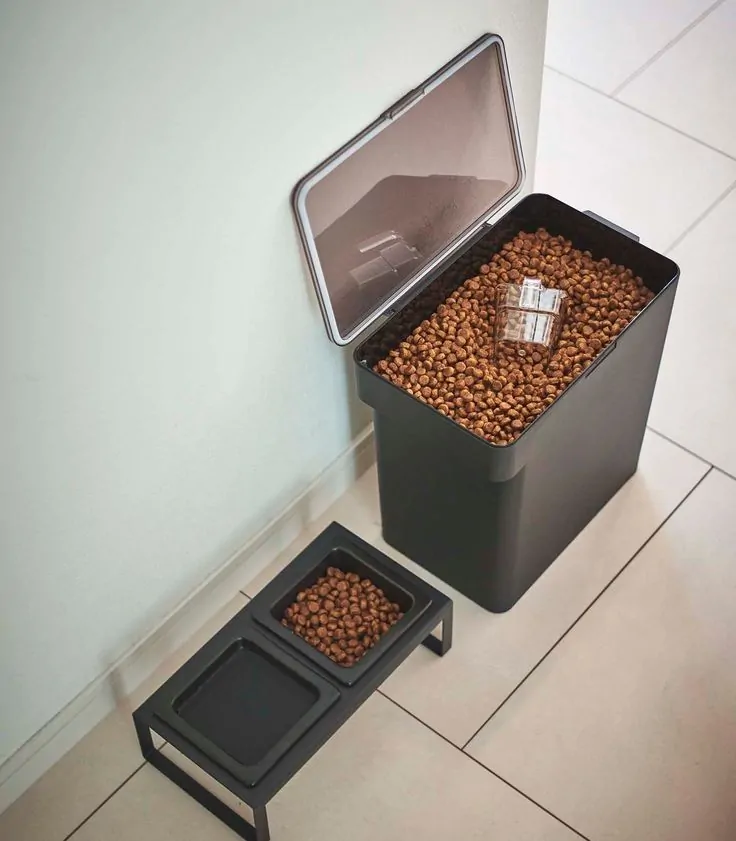 Black storage bin dog feeder idea with bowl stand