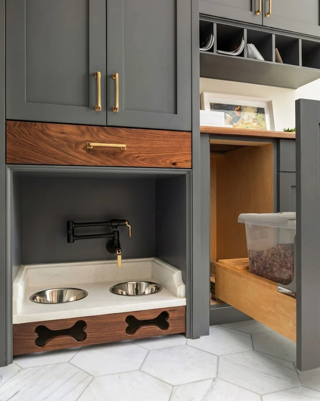 Built in cabinetry dog feeding nook with marble tray