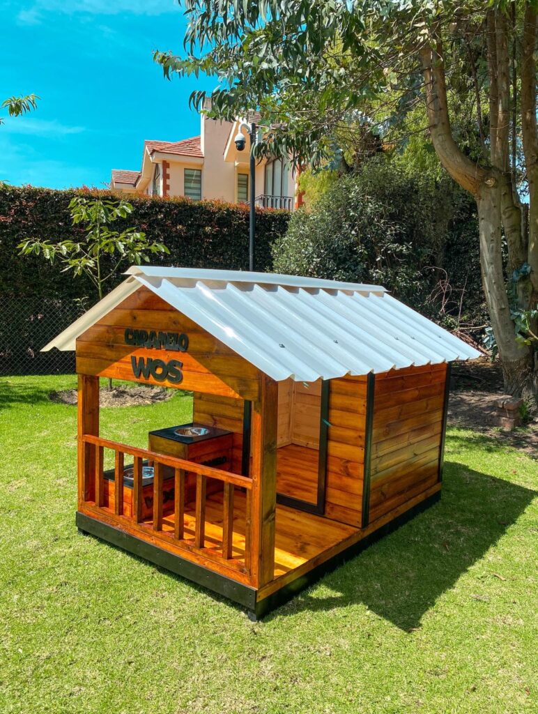 Wooden dog house idea with custom name sign and metal roof