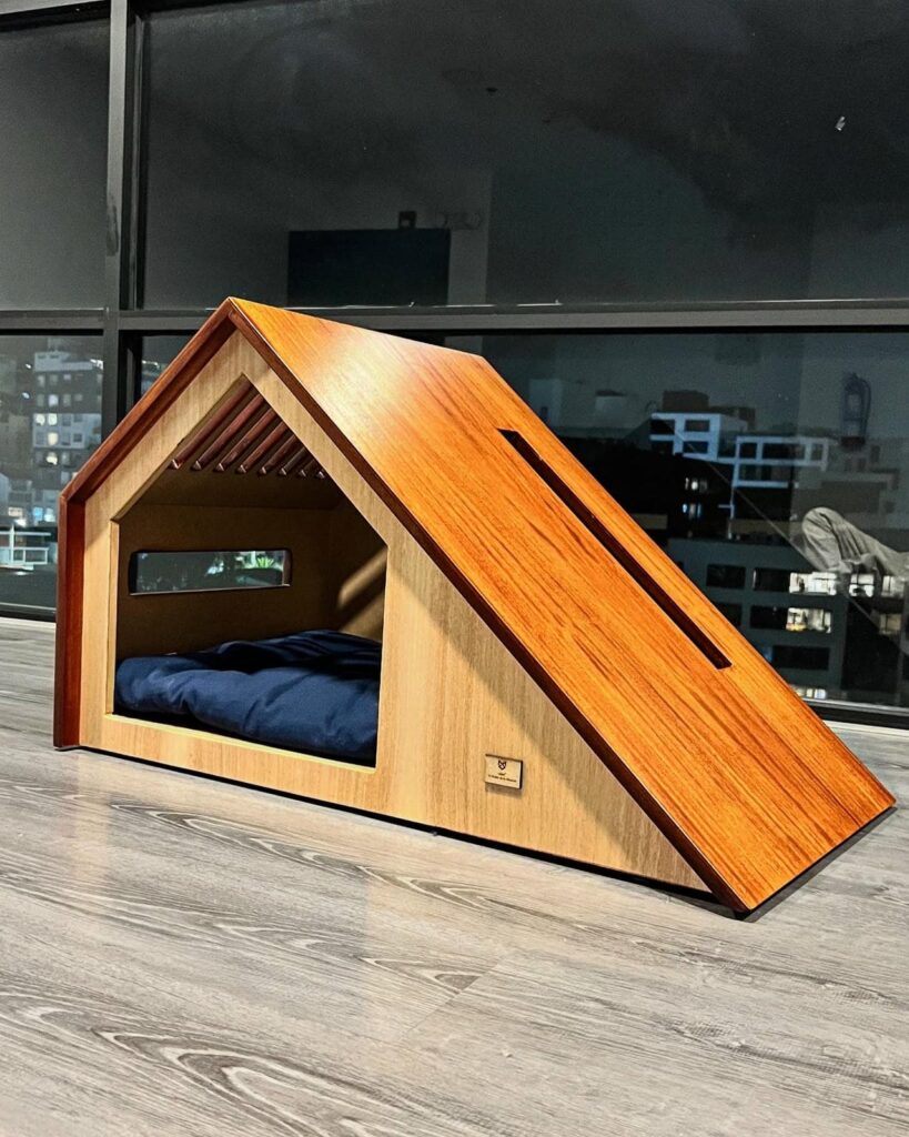 Architectural wooden dog house idea with low slung A-frame roof