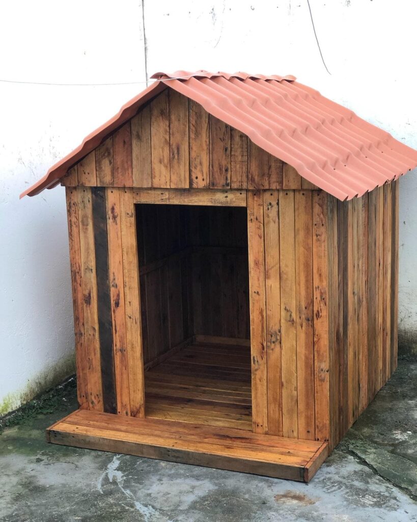 raw pallet dog house with terracotta roof