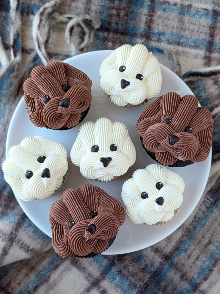 Simple puppy face cupcake with cream buttercream and candy eyes