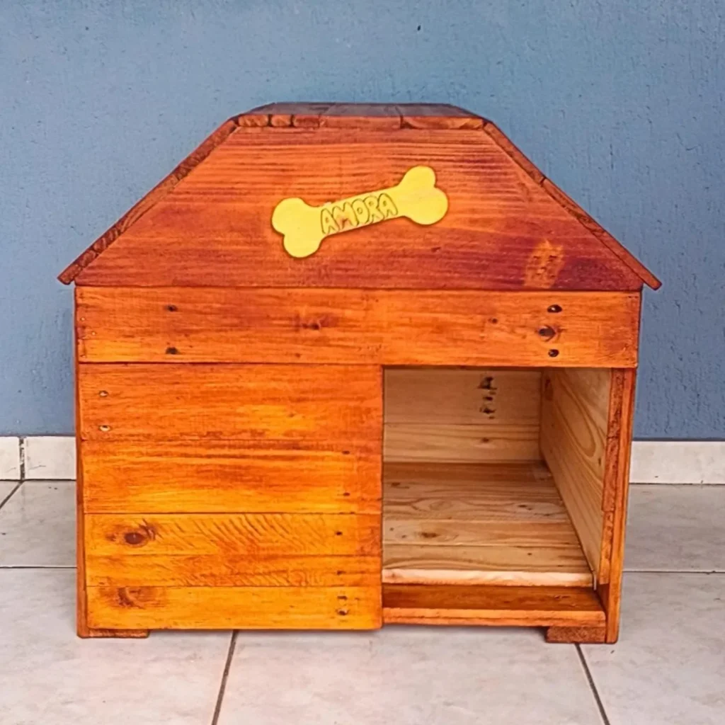 stained pallet dog house with name sign