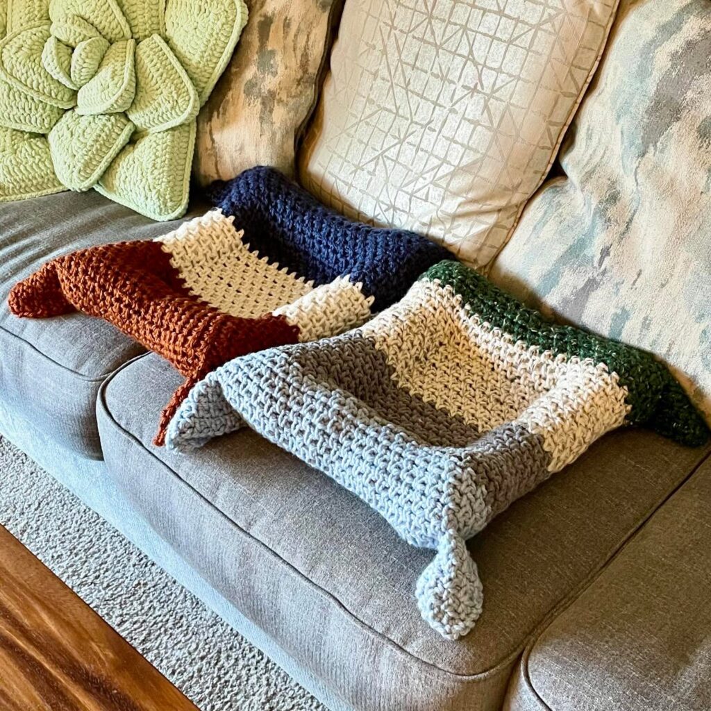 Bone shaped flat crochet mat with colorblock stripes