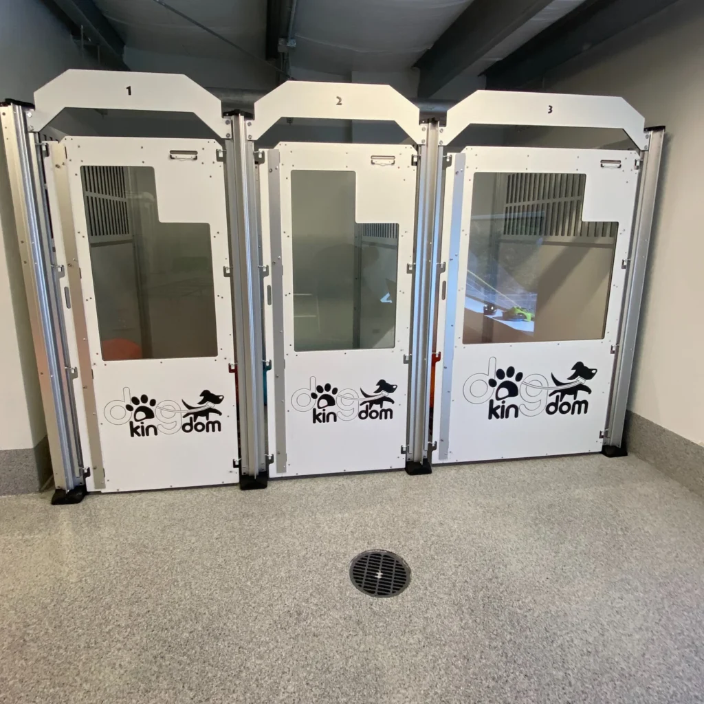 Numbered private room doors with dog hotel branding