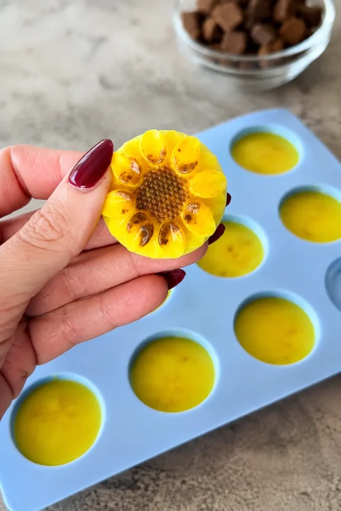 Homemade turmeric dog treats in yellow silicone mold