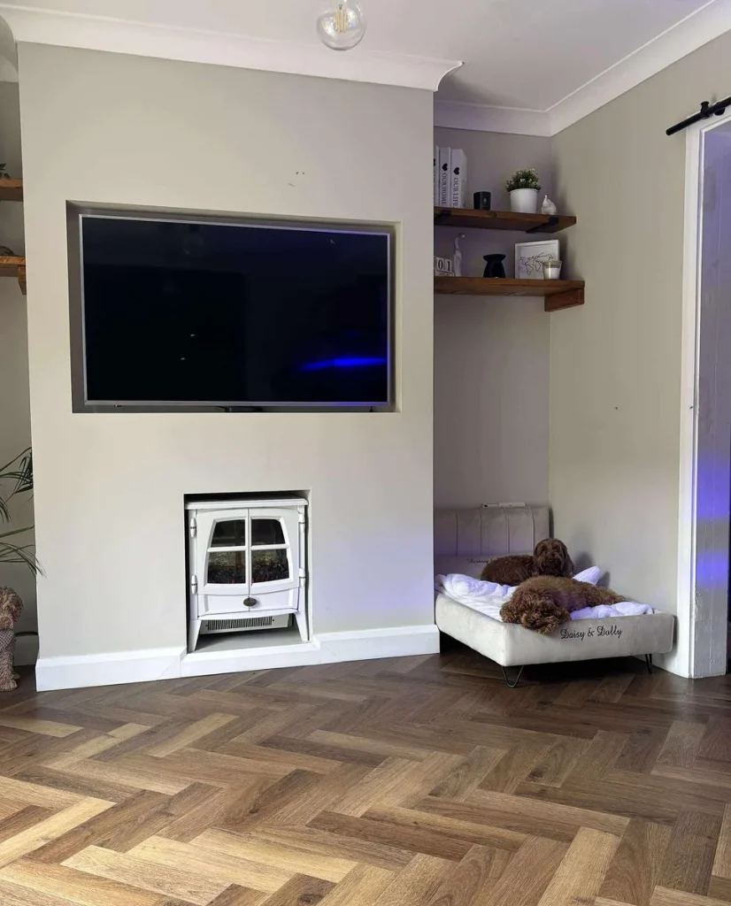 Personalized alcove dog sofa bed tucked beside a fireplace