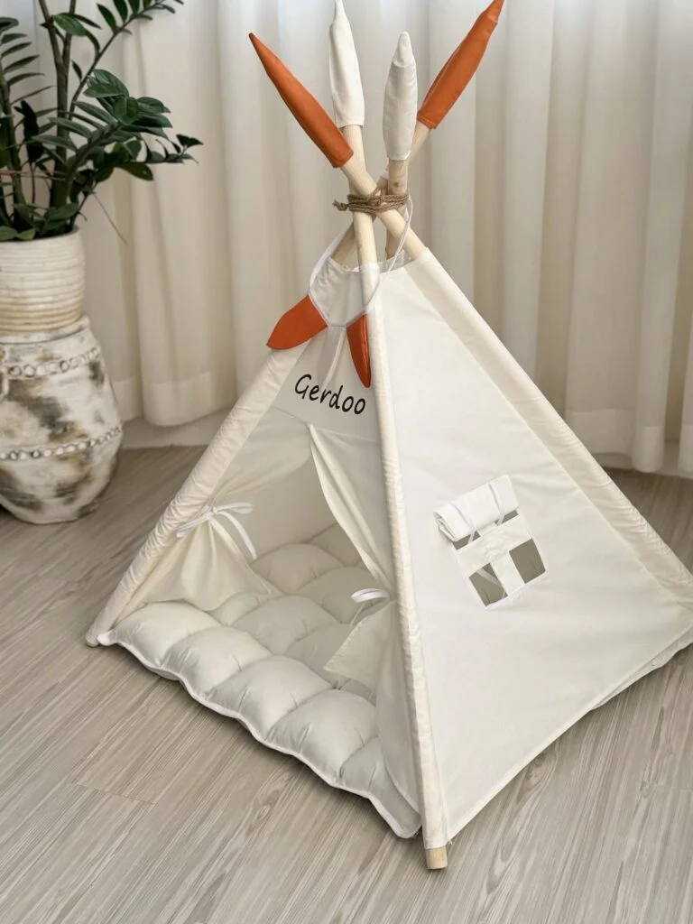 Cream boho teepee tent dog bed with feather details