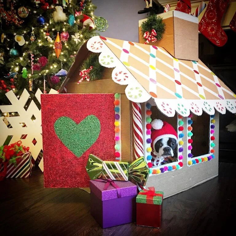 Christmas themed paper dog house idea decorated with pom poms