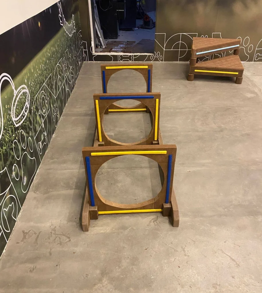 Dog Park ideas featuring circular cutout agility hurdles for dogs