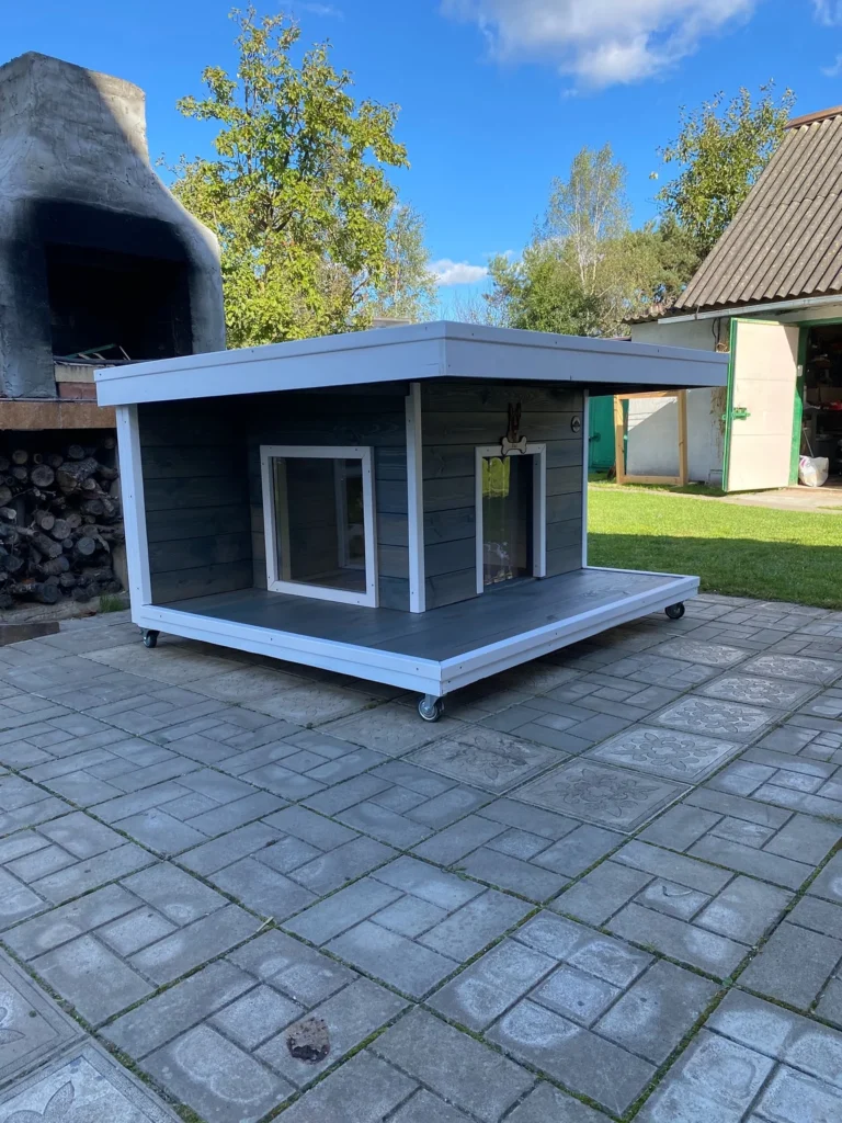 Insulated dog house ideas with flat roof and porch on wheels