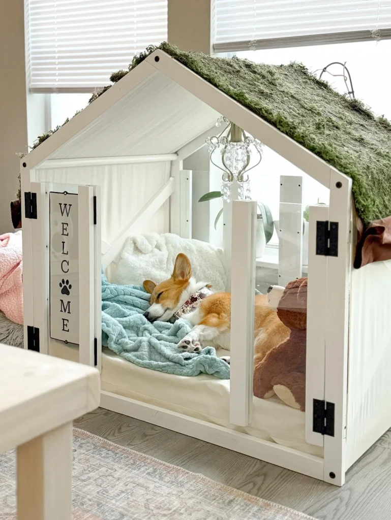 Moss roofed cottage dog house with mini chandelier