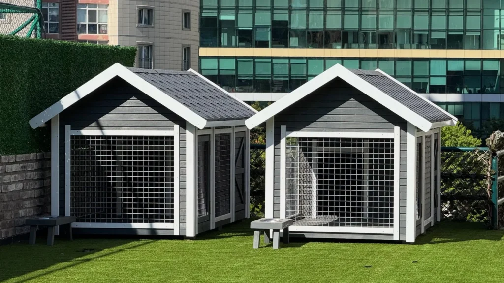 Twin kennel style dog houses with matching feeding stations