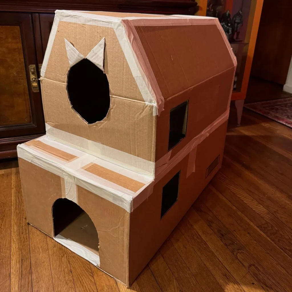 Two story paper dog house idea with peaked roof and arched entry