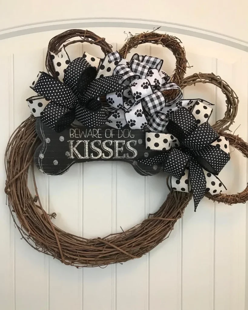 Black and white paw print dog wreath with buffalo check bows