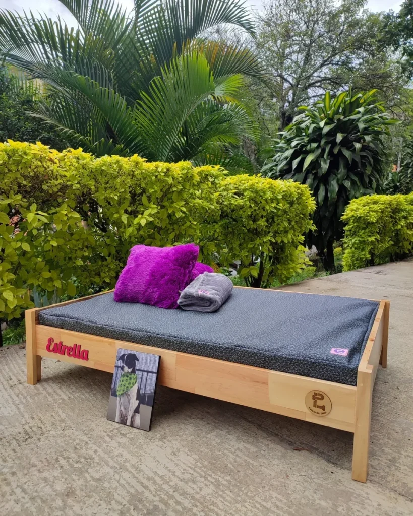 Custom wooden platform outdoor dog bed idea with name plaque